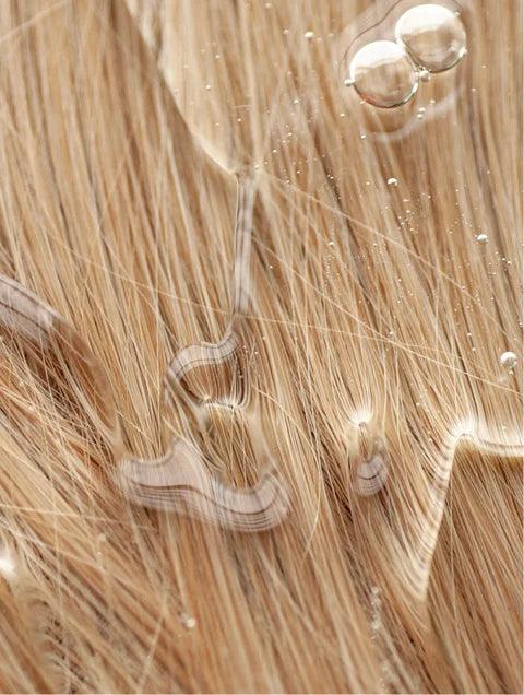 Colour Care Shampoo in Peachy Grapefruit Zest being applied to hair, creating a rich lather while protecting color and adding shine